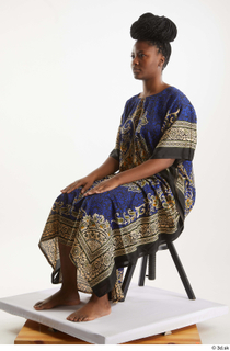 Dina Moses  1 dressed sitting traditional decora long african…